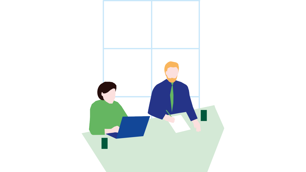 Två personer sitter framför ett fönster. En skriver på en laptop, den andra skriver på ett papper.