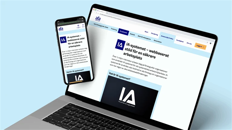 Dator och telefon med sidan för IW-systemet på webbplatsen för Afa Försäkring.
