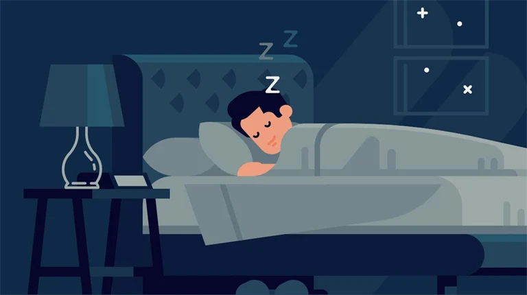 Person som sover i ett mörkt rum.