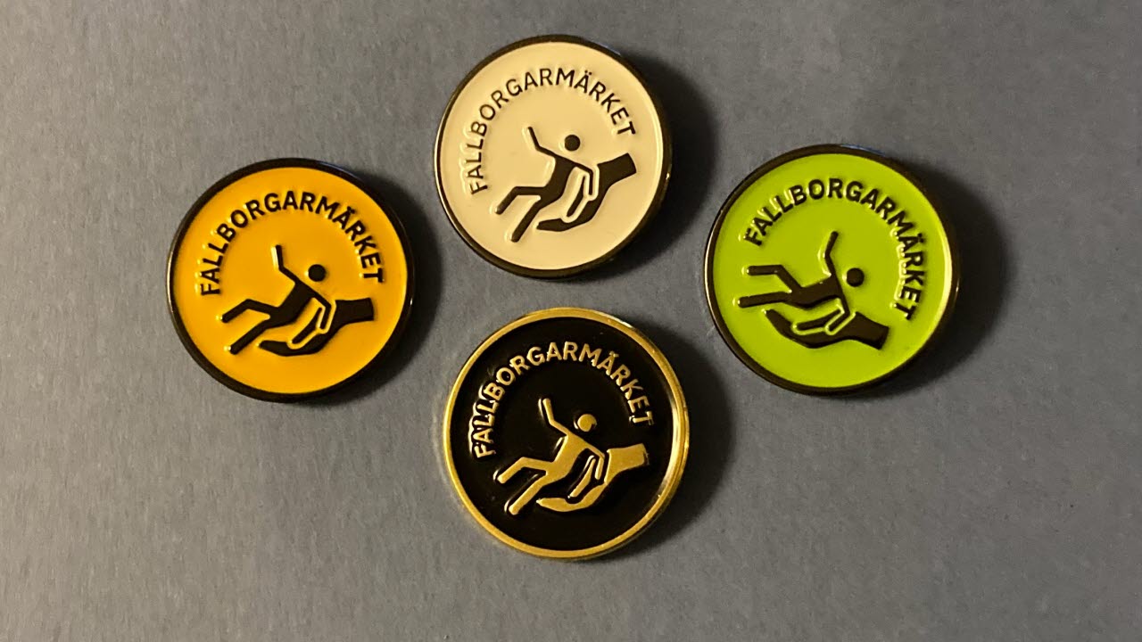 Fallborgarmärket i olika färger på en grå bakgrund.